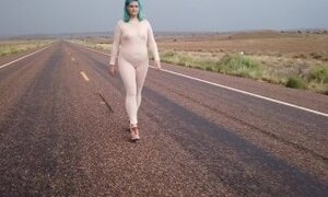 MILF in SHEER catsuit walking down highway