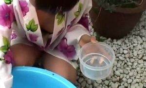 Asian stepmother peeked in the garden