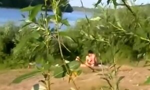 Nude couple spied in the nature having sex