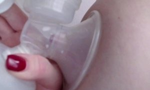 'Milf lactating her big boobs with brest pump'